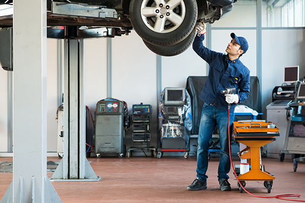 Mechanic working on car